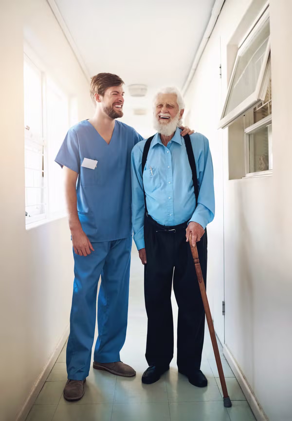 Smiling senior and caring home health aide